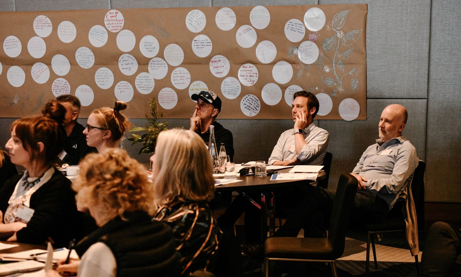 a group of people watching a presentation